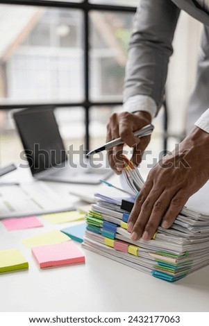 Businessman analysis plan Accountant calculates financial reports Computer with graphs, business concepts, finance and accounting, budget and loan paper in office Take a close-up, vertical photo.