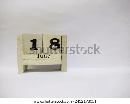 18 june wooden calendar in white background Royalty-Free Stock Photo #2432178051