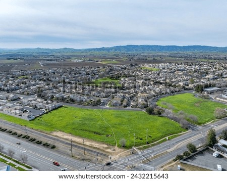 Drone photos over vacant land in a community in a community in northern California. Green space vacant land. Commercial Real Estate Royalty-Free Stock Photo #2432215643