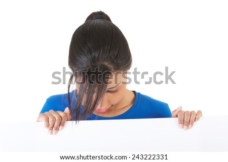Woman holding blank banner and looking on it.