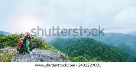  Asian woman Travel photograph Nature. travel relax in the holiday walk in the forest. on a rocky cliff. Thailand 