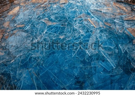 Broken glass panes in the waste glass container Royalty-Free Stock Photo #2432230995