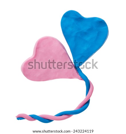 Pink and blue plasticine heart. Isolated on white background