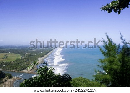 photo of a view of the coastline with blue sea water
