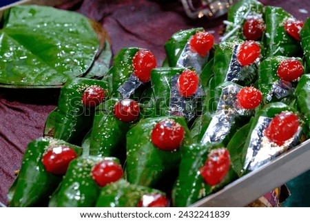 Sweet paan, meetha pan, Betel leaves mouth Freshener, Traditional indian dessert Paan made with Betel leaf and other ingreditients is eaten as a dessert and also aids as a mouth freshner. Royalty-Free Stock Photo #2432241839