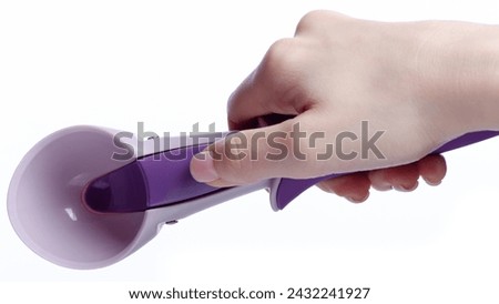 ice cream spoon in hand on white background isolation