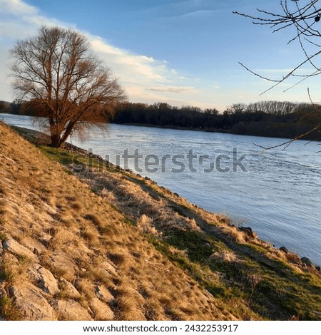 Confluence of rivers Danube and Morava near Devin castle in Devin on the border of  Slovakia and Austria, Europe during sunset.  Danube river cruise.