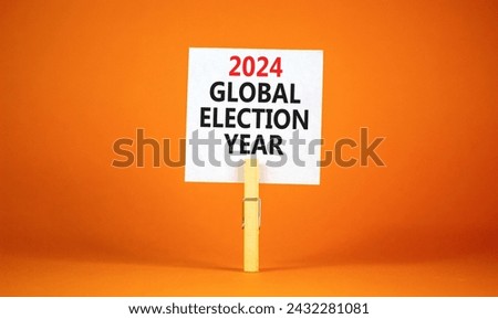 2024 global election year symbol. Concept words 2024 global election year on beautiful white paper on clothespin. Beautiful orange background. Business 2024 global election year concept. Copy space