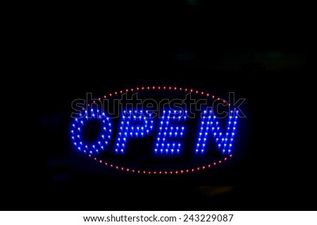 Brightly lit open neon signage