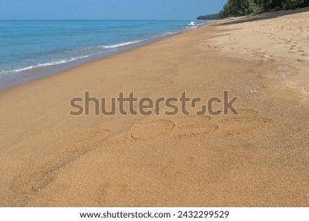 2033 written in the sand on the beach - Happy New Year 