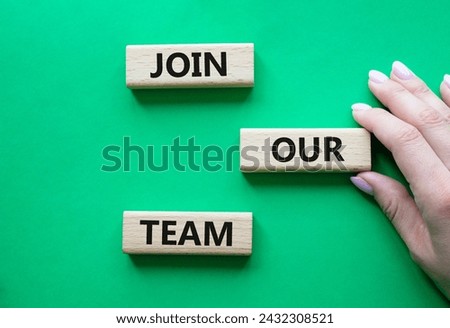 Join our team symbol. Wooden blocks with words Join our team. Beautiful green background. Businessman hand. Business and Join our team concept. Copy space.