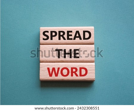 Spread the Word symbol. Concept words Spread the Word on wooden blocks. Beautiful grey green background. Business and Spread the Word concept. Copy space.