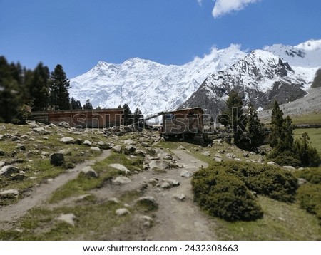 Discover enchantment in the heart of Fairy Meadows, where the majestic Nanga Parbat mountains embrace a winter wonderland. Immerse yourself in the beauty of ice-covered peaks and a picturesque valley.
