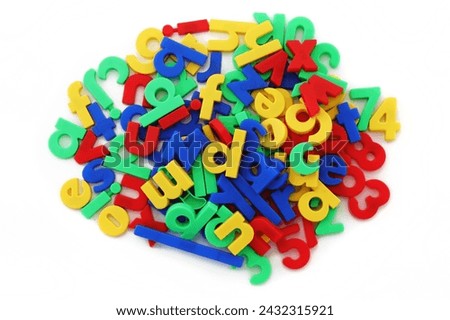 Pile of coloured magnetic letters