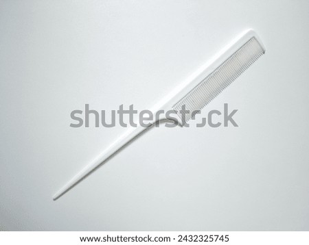 close-up of a white hair comb isolated on a white background.