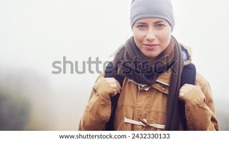 Happy woman, hiking and portrait with backpack, winter and morning fitness for travel in mountain. Strong, athlete and smile face in nature for exercise, outdoor and walking for health in environment