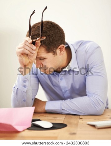 Stress, job loss and businessman at desk with fear of bankruptcy, debt and letter of unemployment. Anxiety, depression and burnout, business risk and frustrated man in office with termination notice Royalty-Free Stock Photo #2432330803