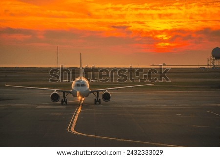An airbus A320 at sunset at Vancouver International Airport Royalty-Free Stock Photo #2432333029