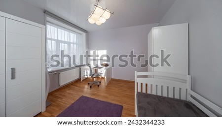Living room in the modern flat. Lighti from th ewindow. Royalty-Free Stock Photo #2432344233