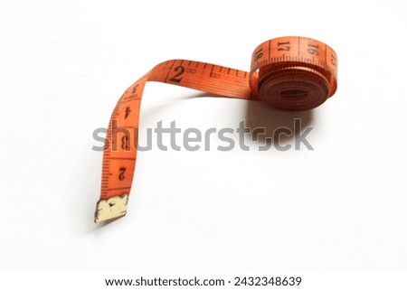 A tape measure is a length measuring tool in the form of a tape that is usually used by tailors to measure basic fabric materials and to measure a person's body.