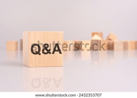 close-up shot of the text Q and A on a wooden block conveys the concept of question and answer