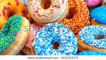 Donuts with sprinkles Close-up picture with high-resolution  on pink background 