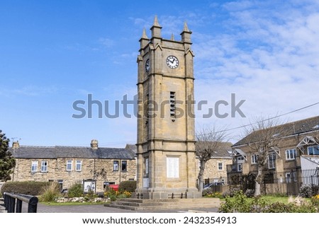 Amble, Morpeth, Northumberland, England, Great Briton, United Kingdom. Clock tower in a square in Amble. Royalty-Free Stock Photo #2432354913