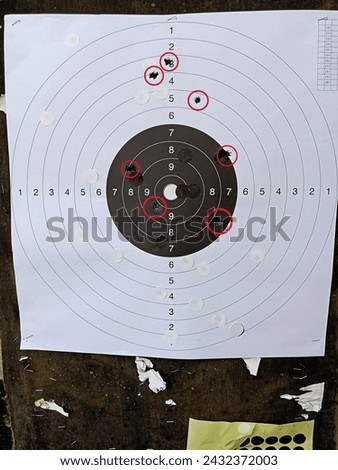 shooting practice with 7 hits on target Royalty-Free Stock Photo #2432372003