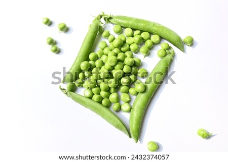 Fresh green pea isolated on white background. There is a lot of vitamins  and Minerals in it. The pea is most commonly the small spherical seed or the seed. Popular vegetable of all over world.  Royalty-Free Stock Photo #2432374057