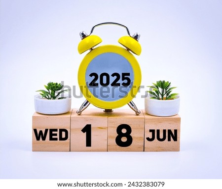 Wednesday 18 june 2025,calendar concept, wooden calendar  Royalty-Free Stock Photo #2432383079