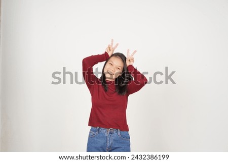 Young Asian woman in Red t-shirt smiling and showing peace or victory sign showing  isolated on white background