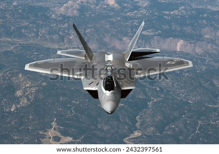 A U.S. Air Force F-22 Raptor from the 1st Fighter Wing and 94th Fighter Squadron transits back to Joint Base Langley-Eustis, Va. after participating in Red Flag  Royalty-Free Stock Photo #2432397561