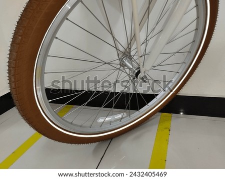 a set of front wheel parts on a bicycle consisting of tires, rims, spokes and axle or hub