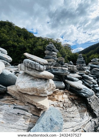Stacks of rocks at Fantail Falls ,Haast Pass, South Island , New Zealand 