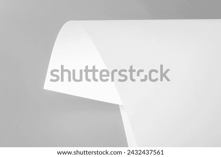 White sheet of paper as background. Black and white image.