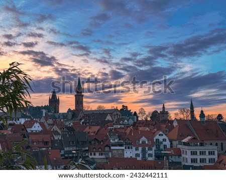 beautifully colored evening sky over a small historic old town. Sunset in Weinheim