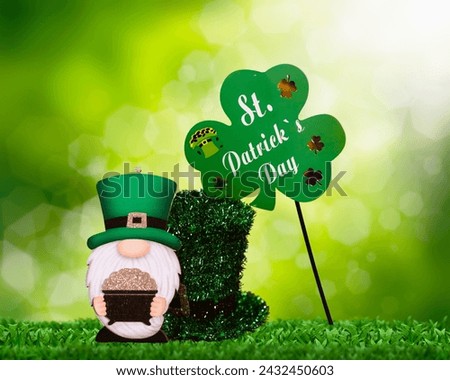 The image features a couple of cacti with a sign that says "St. Patrick's Day." The cacti are depicted in a cartoon style, and the overall theme appears to be related to St. Patrick's Day. The image i