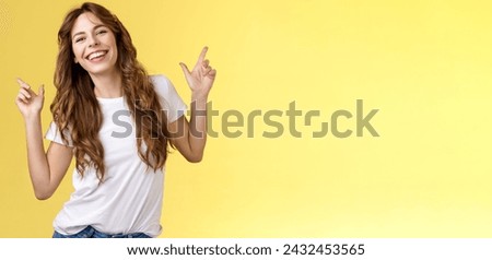Outgoing cheerful attractive woman curly haircut wear casual white t-shirt dancing party having fun pointing up disco moves having fun smiling broadly enjoy holidays anticipating summer trip