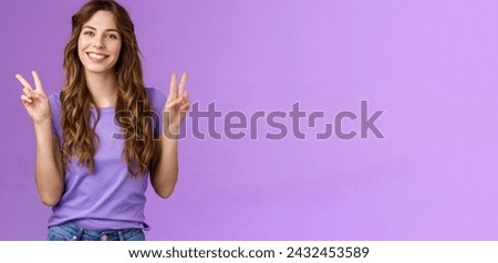 Peace friends. Relaxed friendly cute self-assured girl long curly hairstyle show victory sign smiling broadly cheering express positive optimistic attitude have fun enjoy summer purple background.