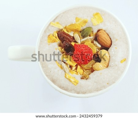 Healthy drinks, fruit smoothies decorated with grains and dried fruits.  Not fat but full and comfortable on the stomach. copy space. Royalty-Free Stock Photo #2432459379