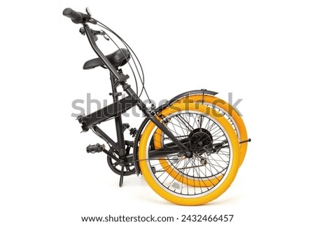 Folding bicycle on a white background Royalty-Free Stock Photo #2432466457