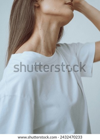 mockup of a girl women white shirt design.Girl's t-shirt mockup template.White t-shirt on a young women template isolated on background.A hipster girl wearing blank white t-shirt and jeans posing