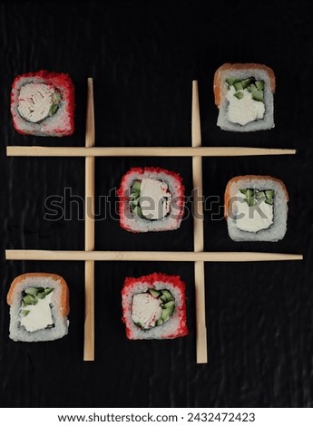 Sushi Tic Tac Toe cold and hot Asian sushi Royalty-Free Stock Photo #2432472423