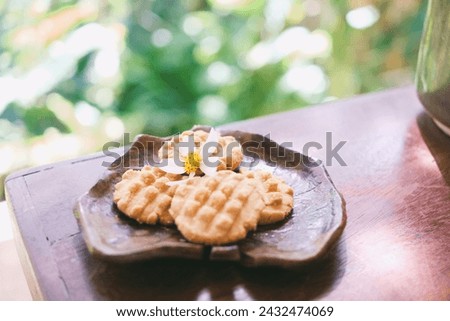 
On the ceramic plate, the petite madeleines look delicate and enticing. The gentle curves of the plate enhance the overall elegance and coziness, creating a realistic and appealing composition. Royalty-Free Stock Photo #2432474069
