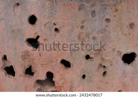 Closeup of shrapnel holes on a Finnish tank from the Second World War.