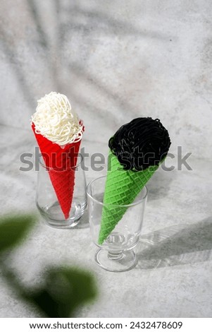 Yogurt ice cream with red and green cones