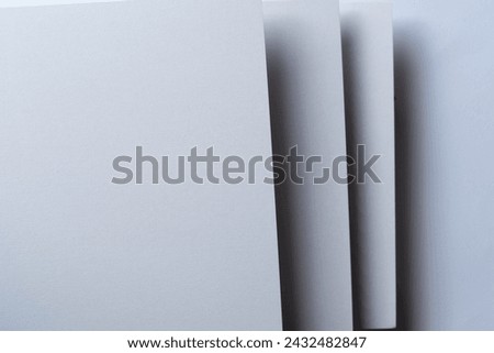 Overlapping white construction paper background