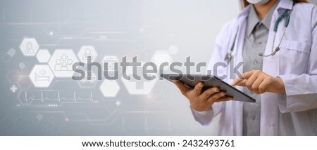 Medical technology concept. Doctor in white coat using digital tablet with medical icons network connection