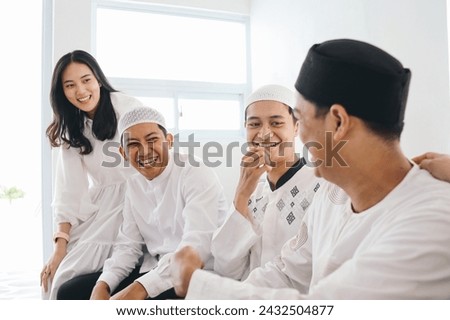 Muslim friends having fun together at home Royalty-Free Stock Photo #2432504877