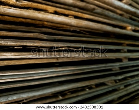 Blurred texture of pile of woven bamboo for background